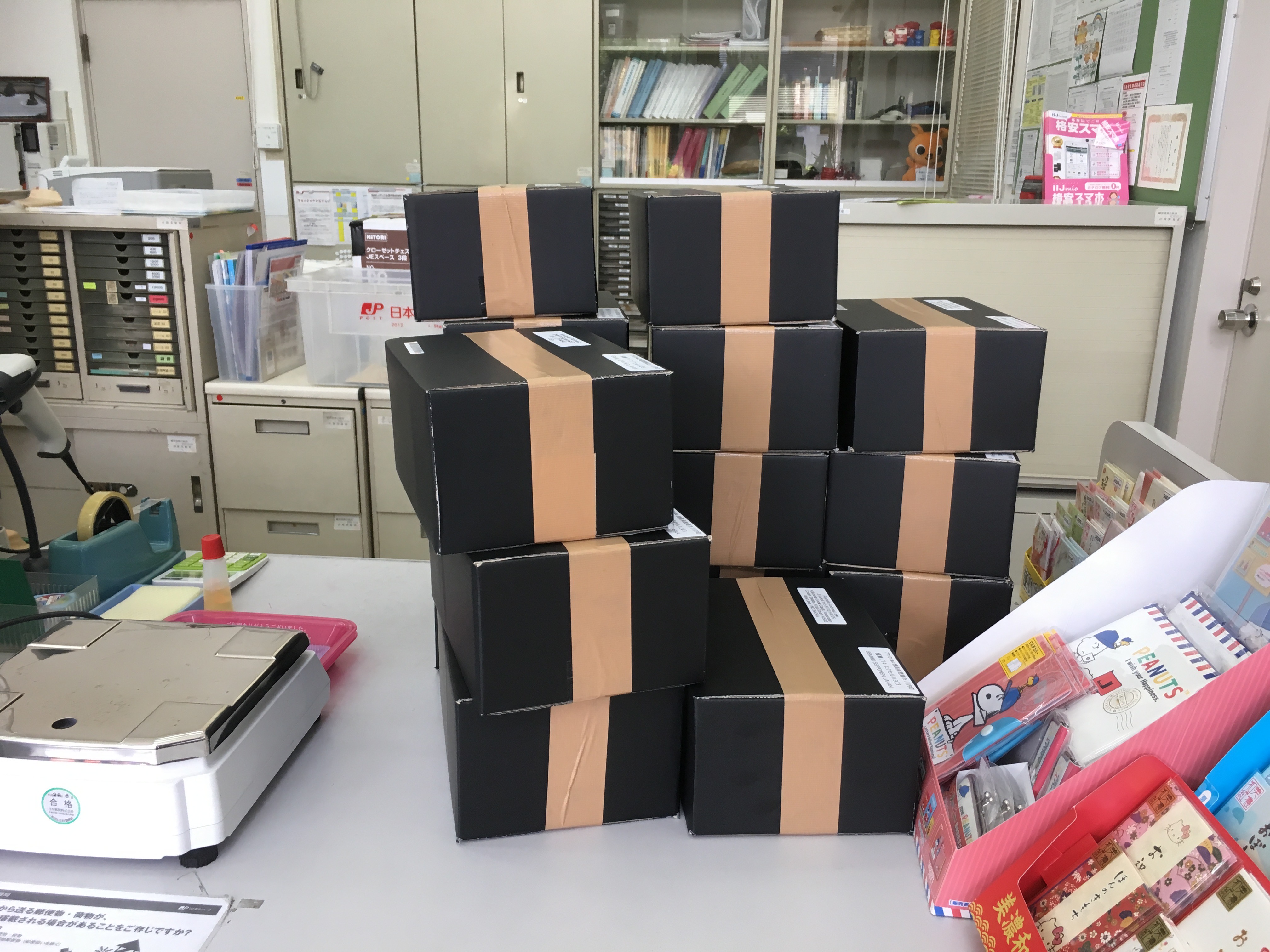 pile of candy sample boxes at Japanese post office