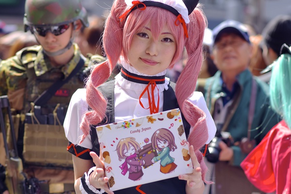 female army officer holding a box of japanese candy